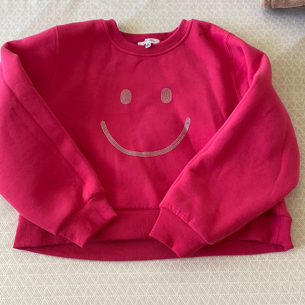 Smiley sweatshirt.